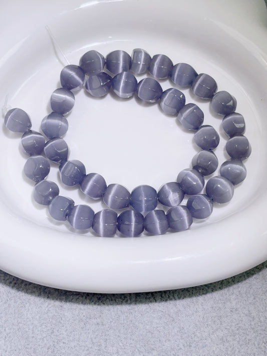 天然石連材-随形珠-10 mm浅紫ローランドキャッツアイ石