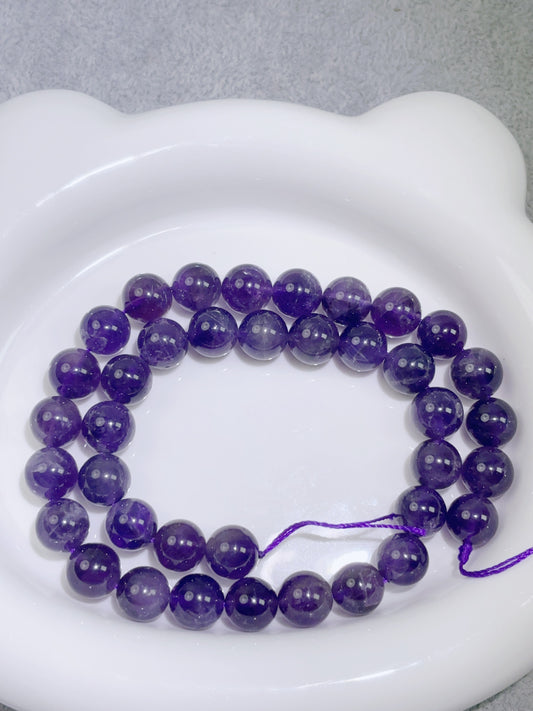 天然石連材--ビーズ-10 mm紫水（少ない綿）
