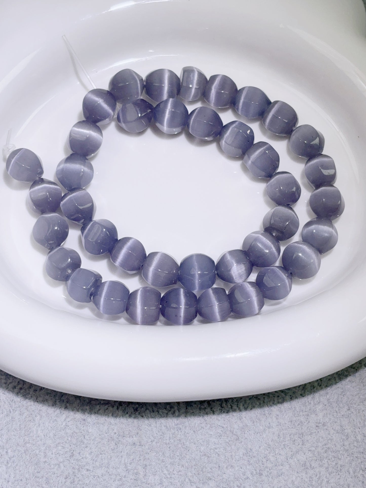 天然石連材-随形珠-10 mm浅紫ローランドキャッツアイ石