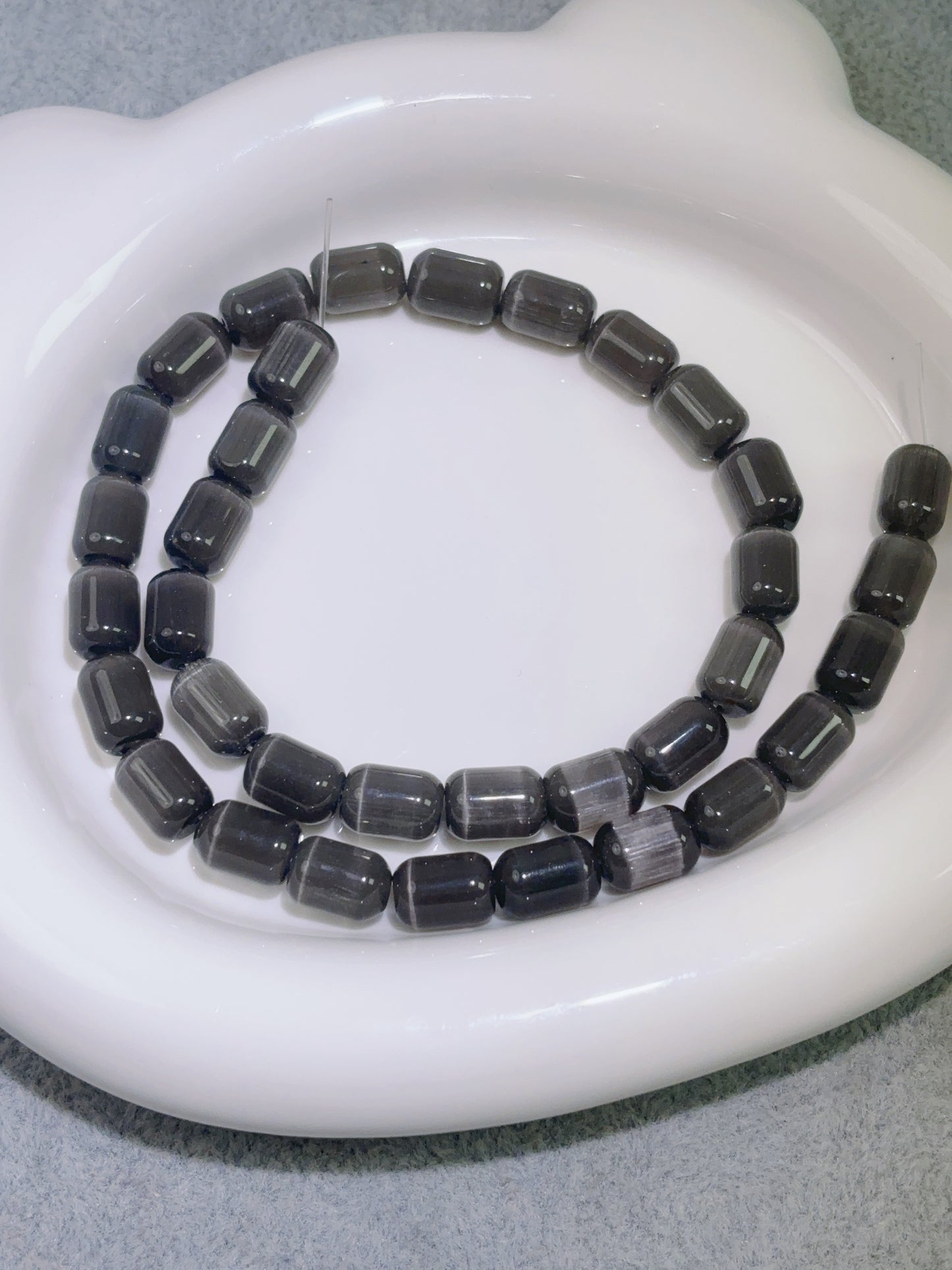 天然石連材-バケツビーズ-8 x 10 mm黒色猫目石