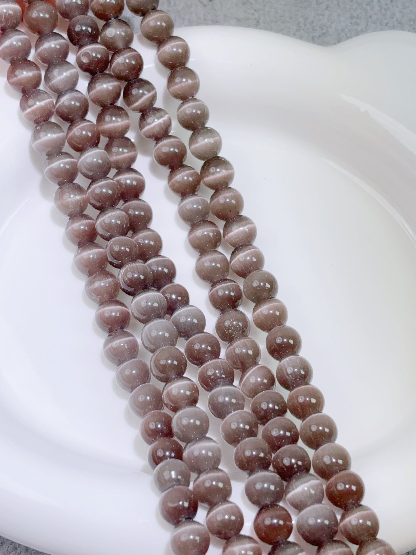 天然石連材-円珠-8 mm茶色猫目石